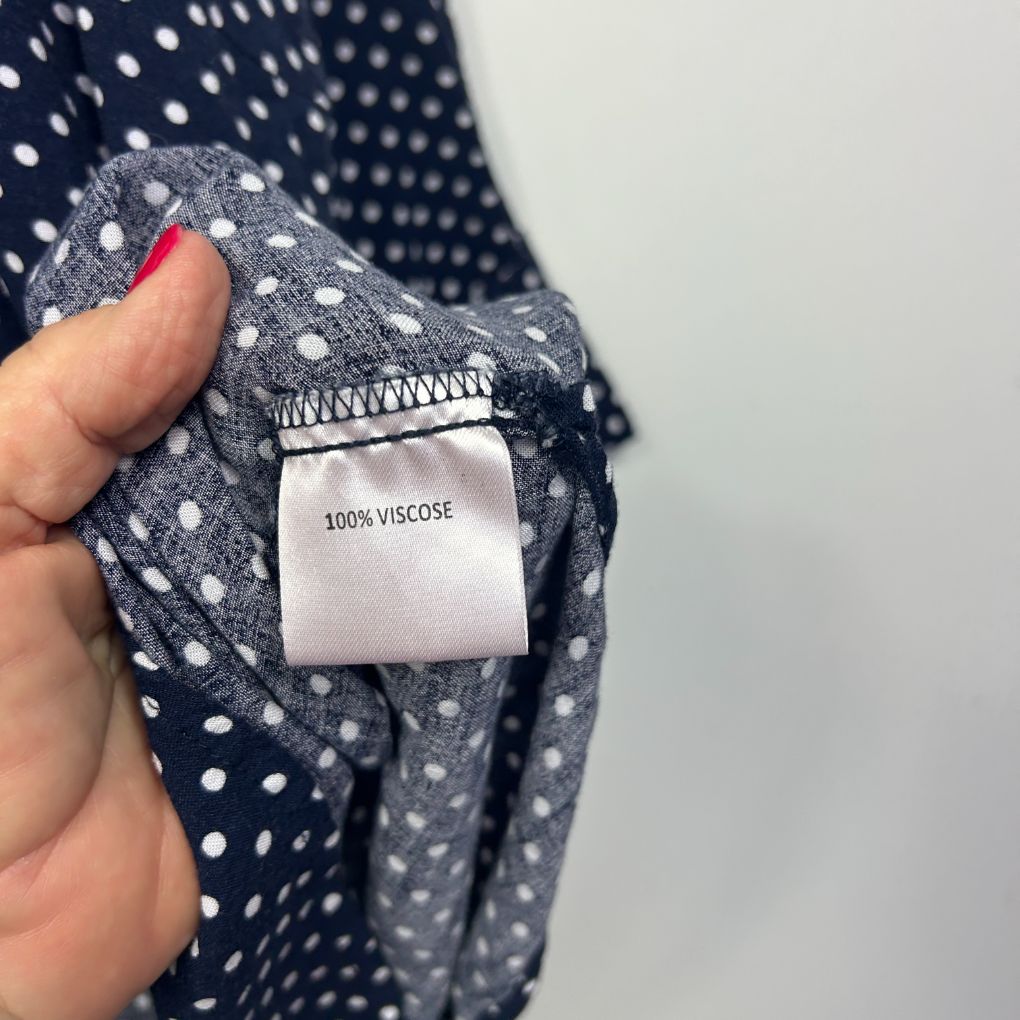 Navy and white polka dot viscose fabric label detail