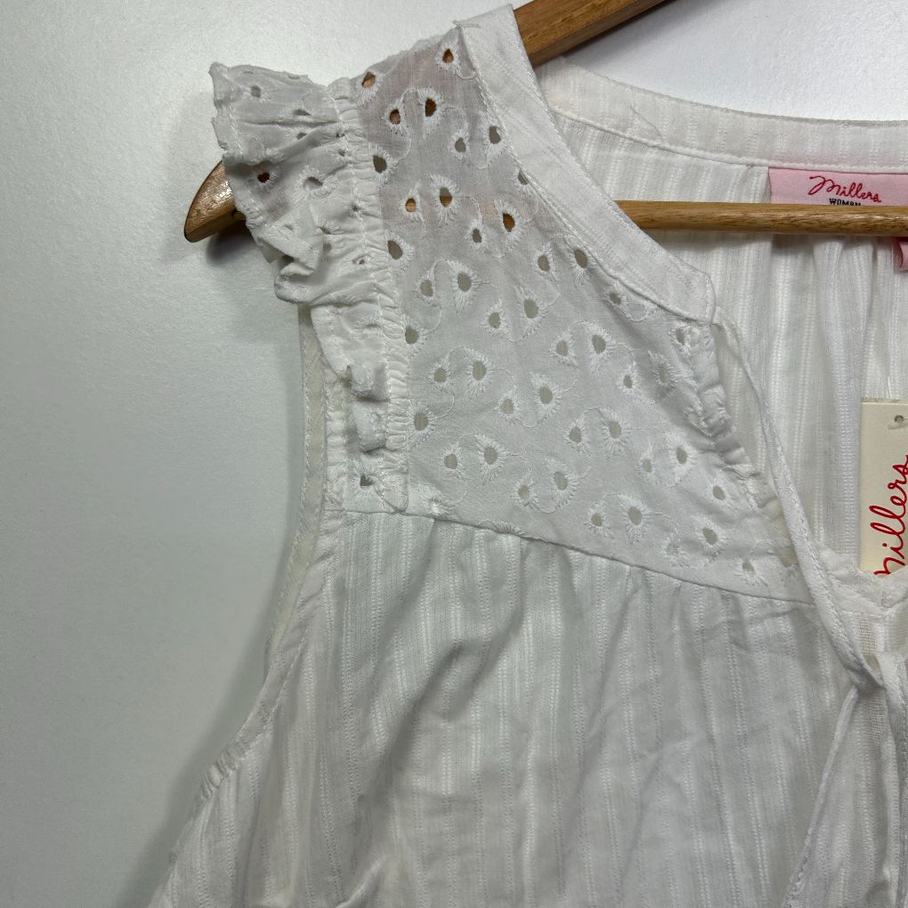 White cotton blouse front view with eyelet embroidery detail