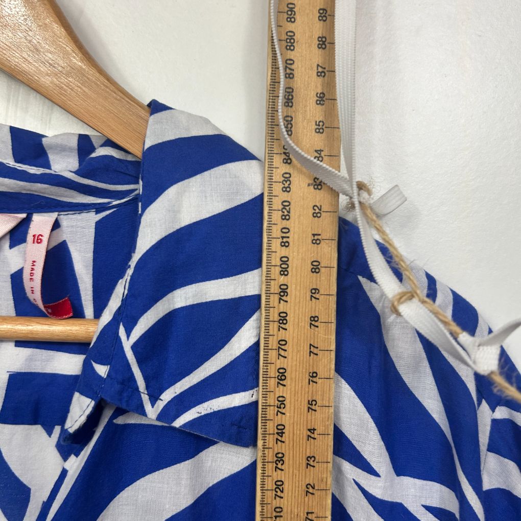 Blue and white striped top detail view with measuring tape