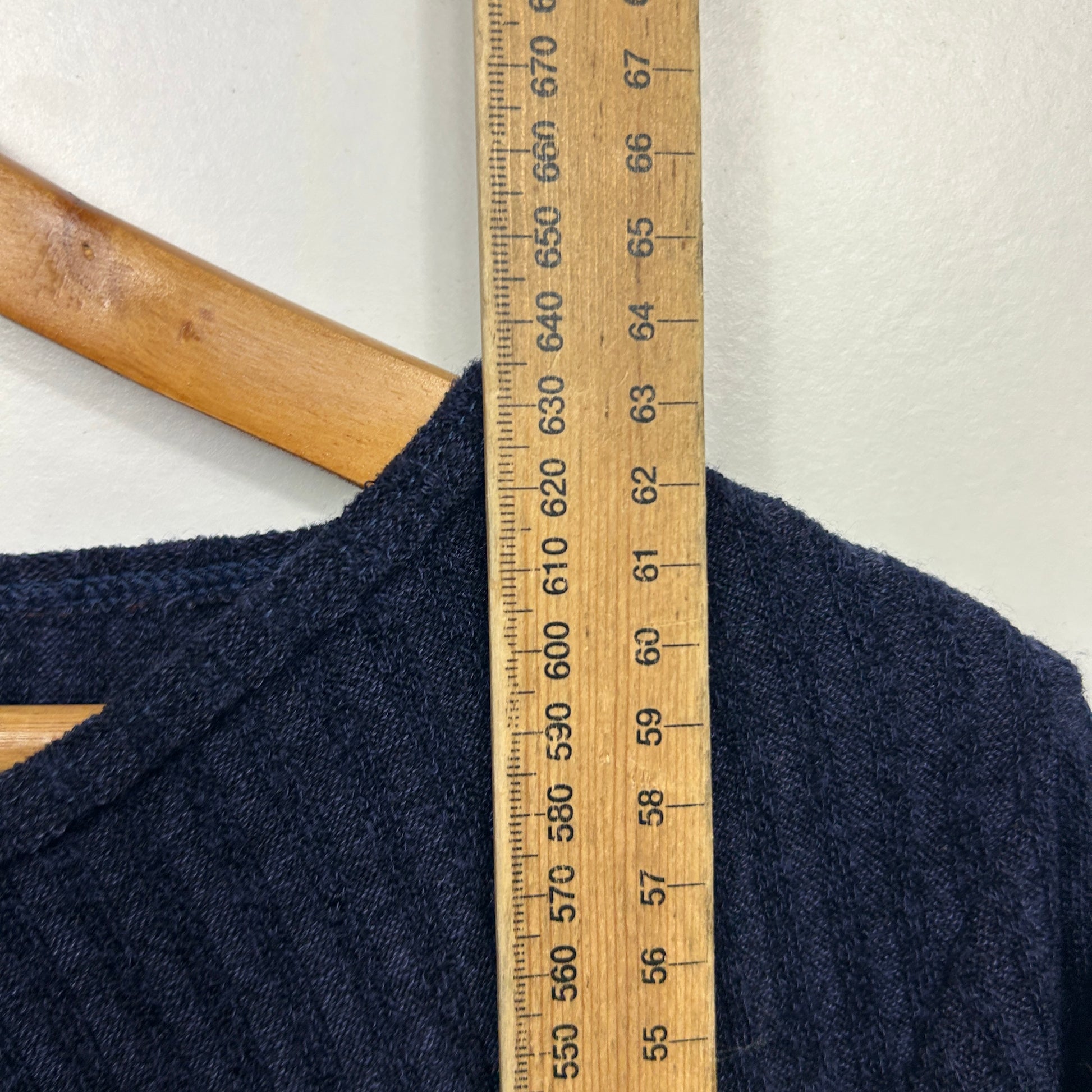 Navy jumper front view with measuring tape