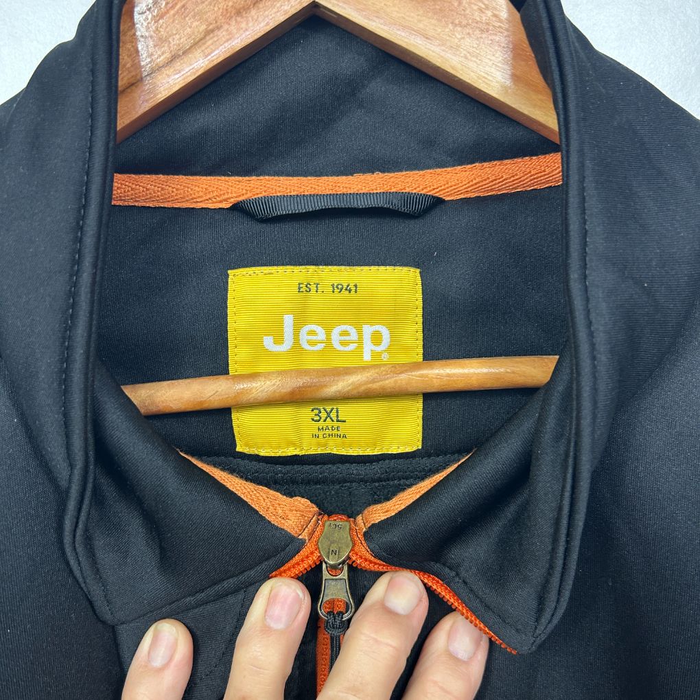 Navy polo shirt front view with orange trim detail