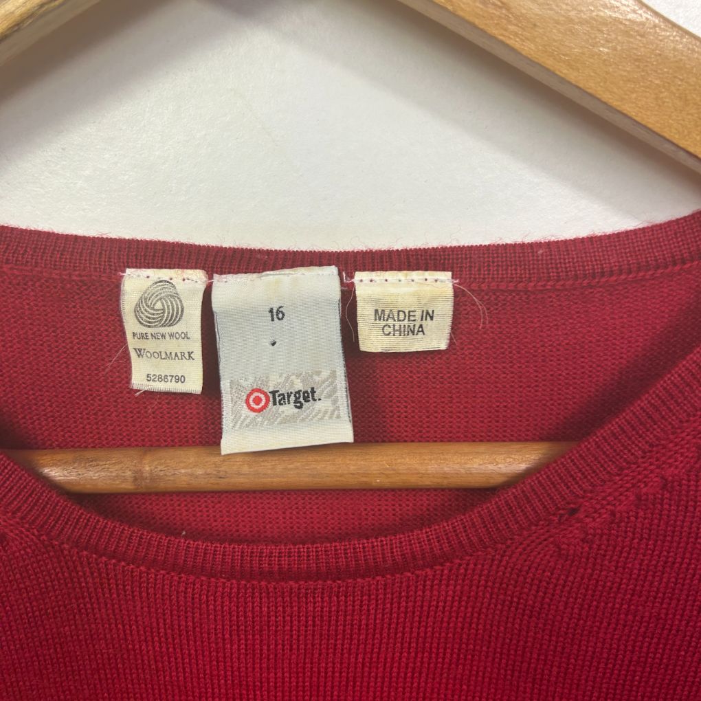 Red knit sweater label detail view