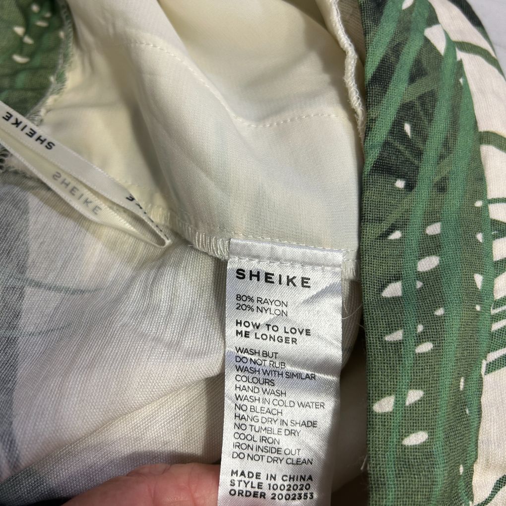 White shirt detail view showing care label
