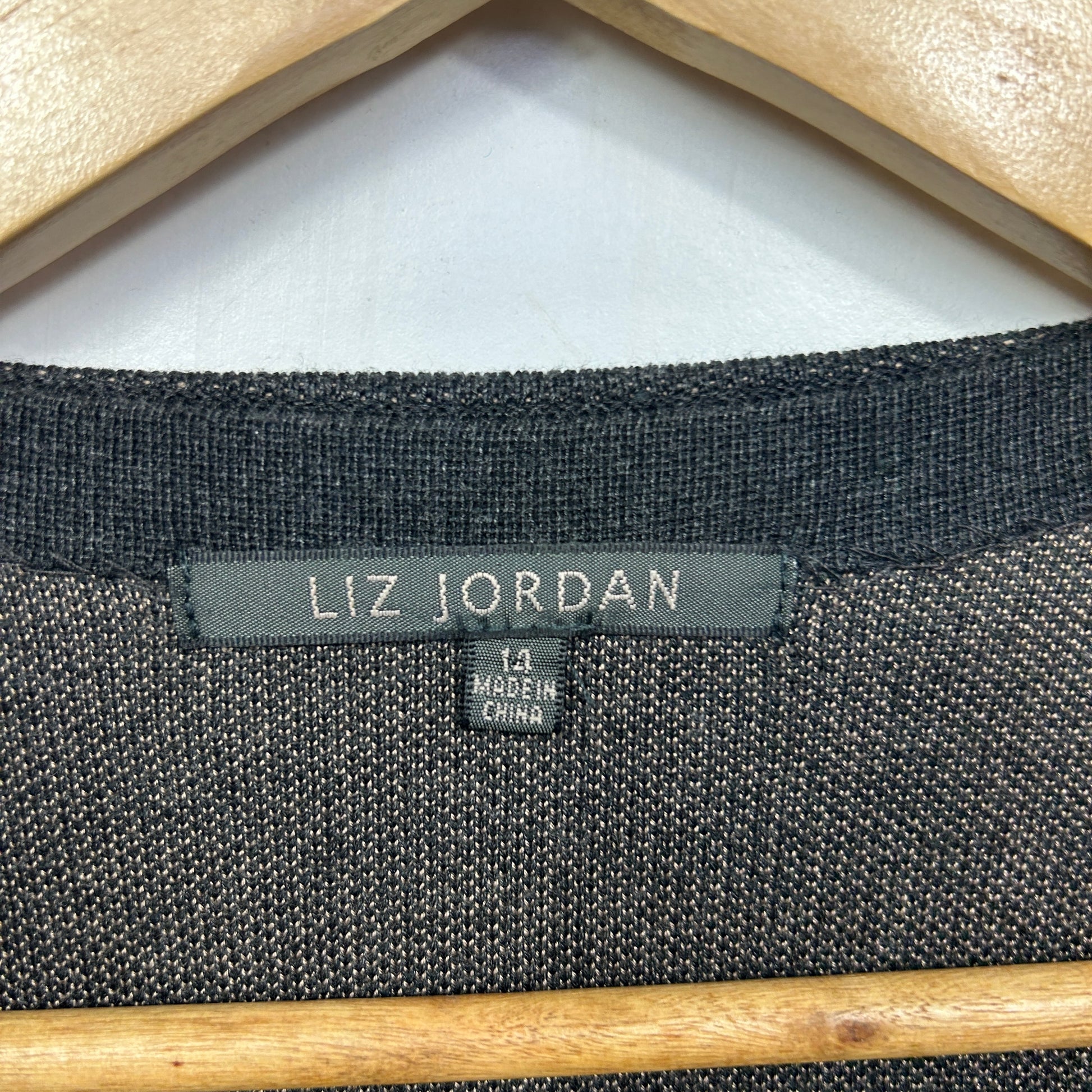 Charcoal grey knit sweater label view