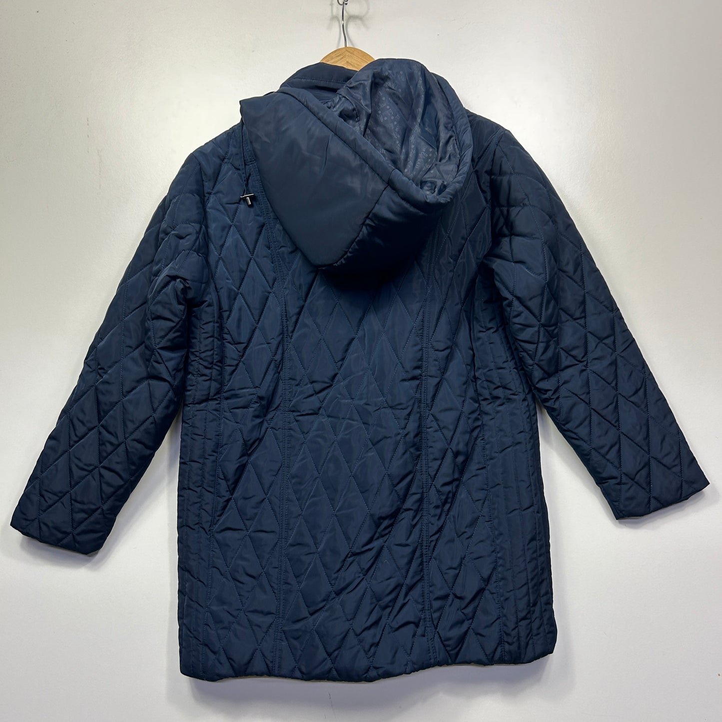 Navy quilted puffer jacket back view