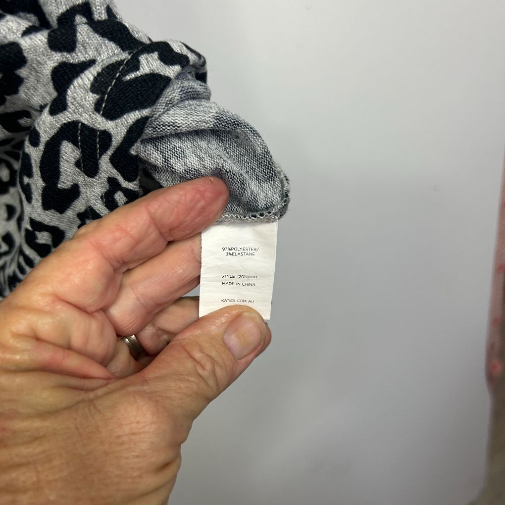 Black and white patterned sweater detail view