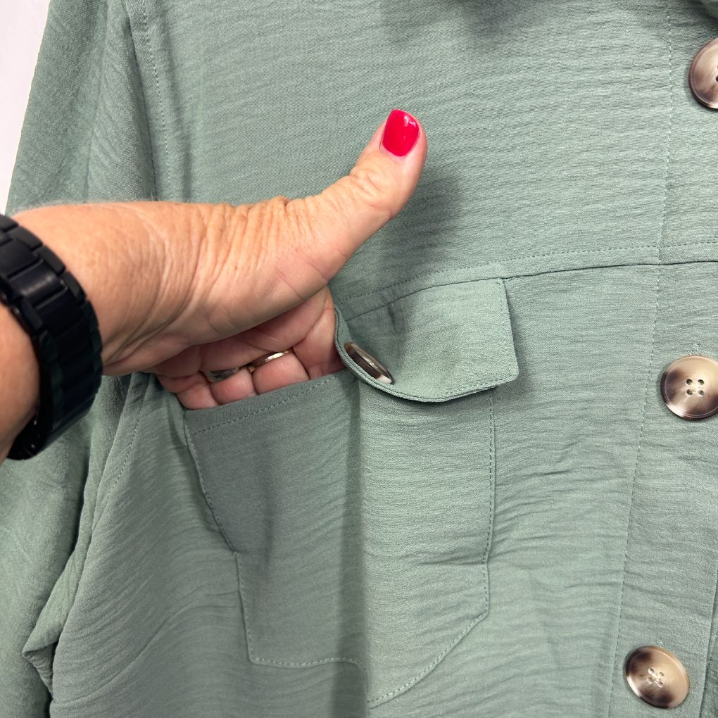 Sage green shirt front view detail of pocket and buttons