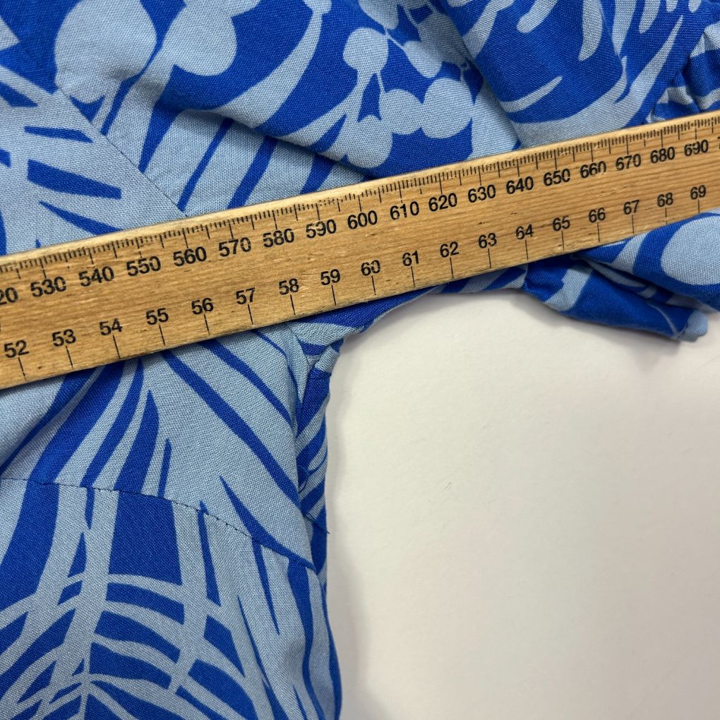 Blue and white fabric with measuring tape detail view