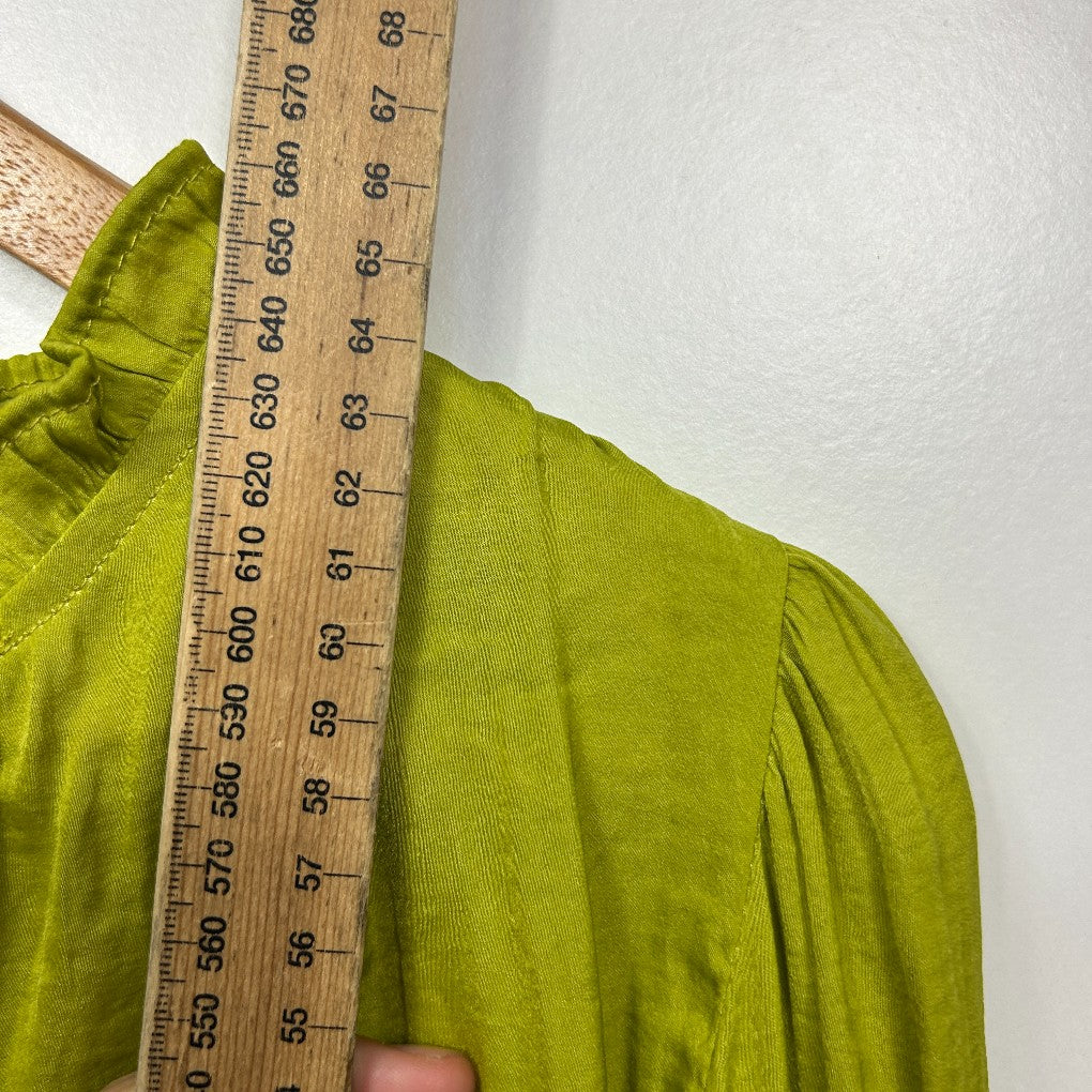 Lime green top detail view with measuring tape