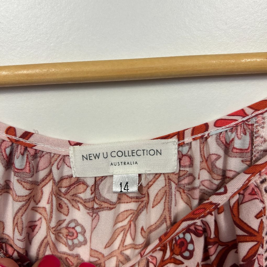 Red floral print dress label detail view