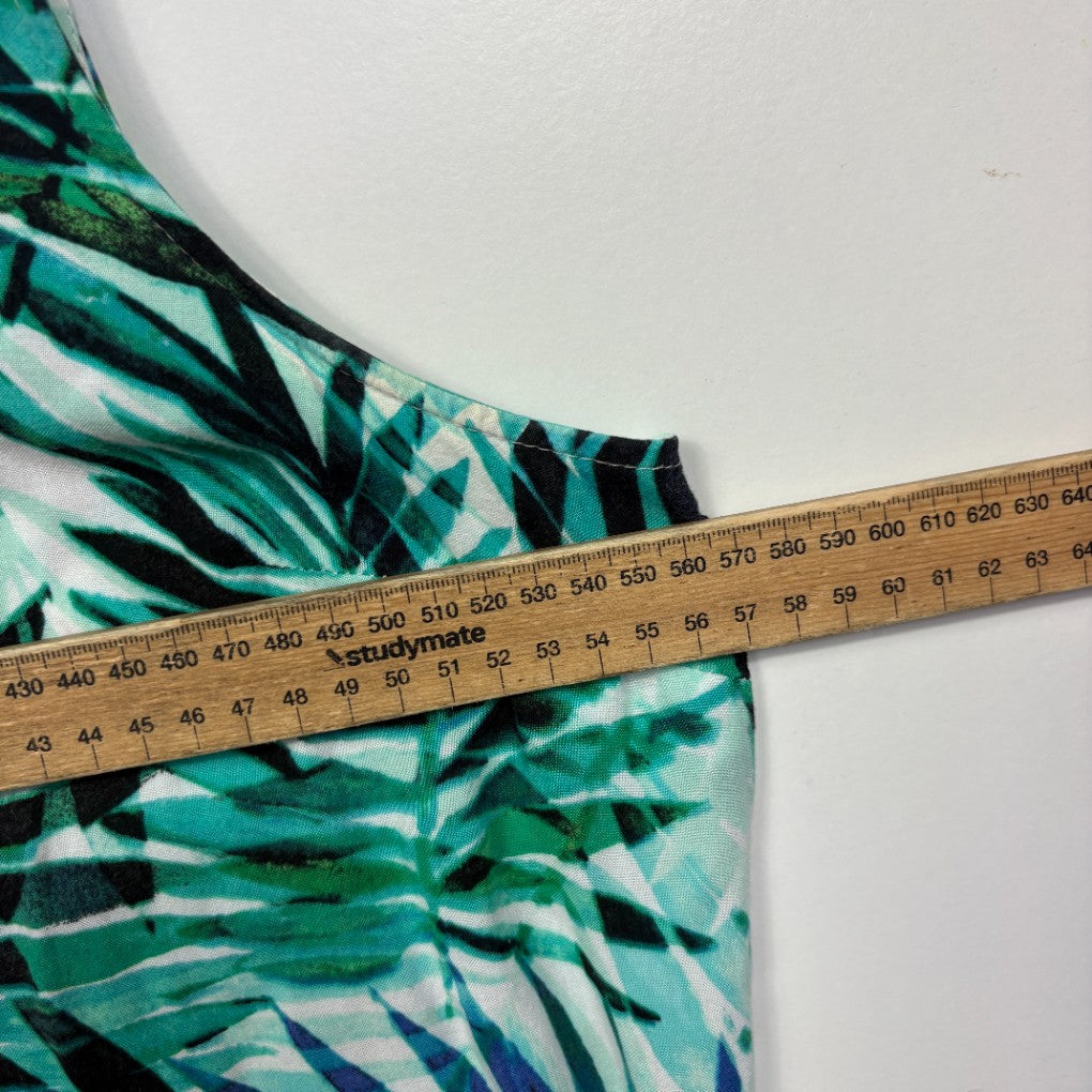 Turquoise and black striped swimwear detail view with measuring tape