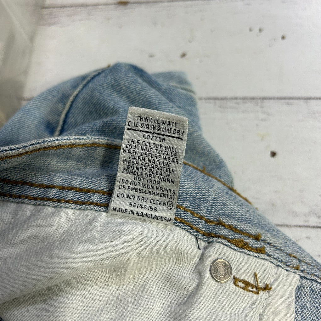 Blue and white denim jeans label detail view