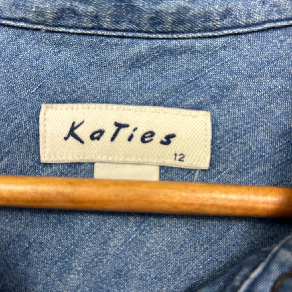 Blue knit top label detail view