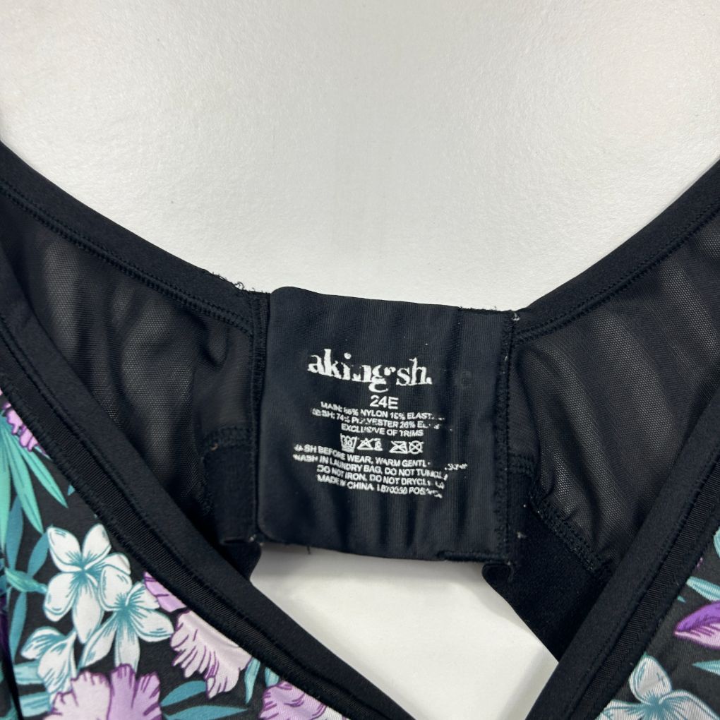 Black swimsuit top with floral print detail view