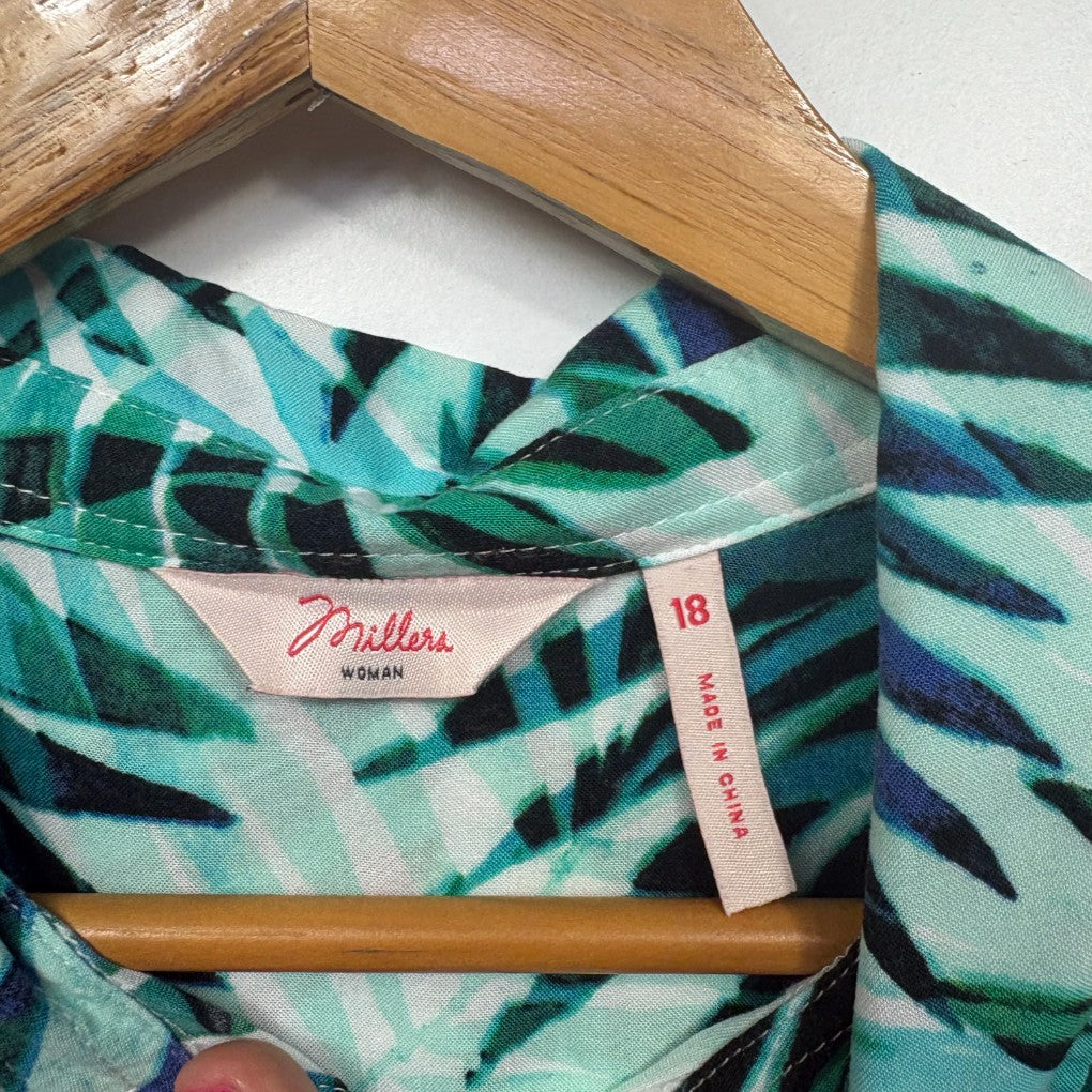 Teal and navy striped long sleeve top on wooden hanger label view