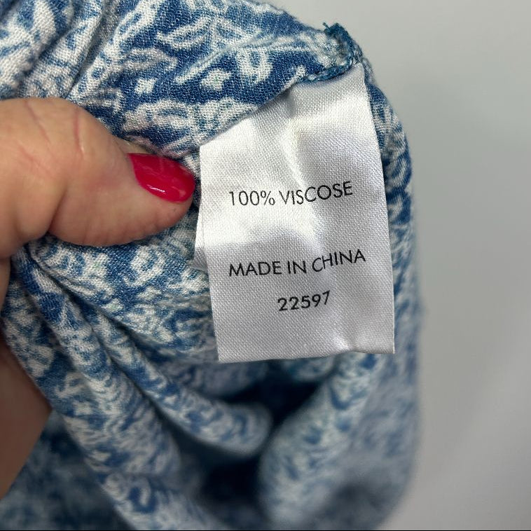 Blue and white patterned viscose fabric label detail view