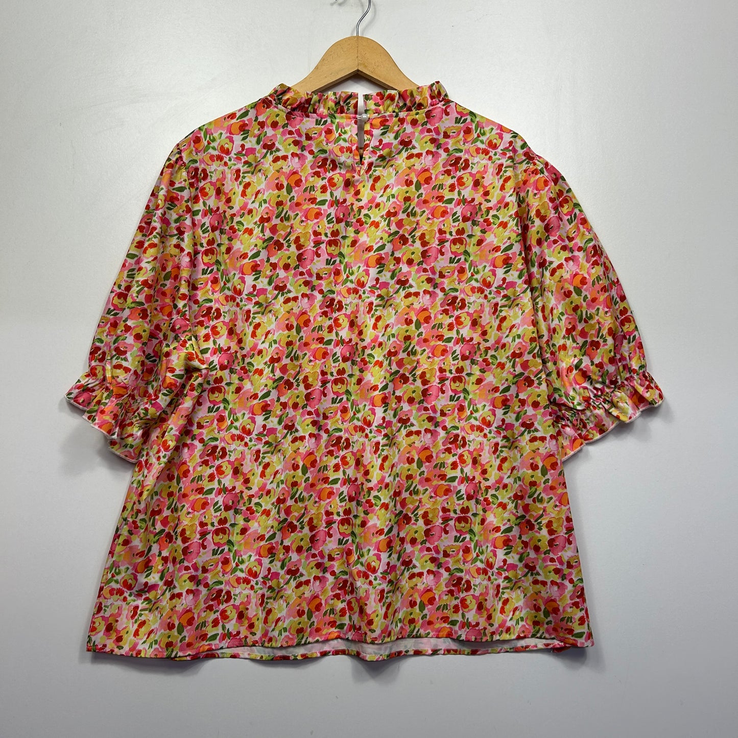 Red and yellow floral blouse front view