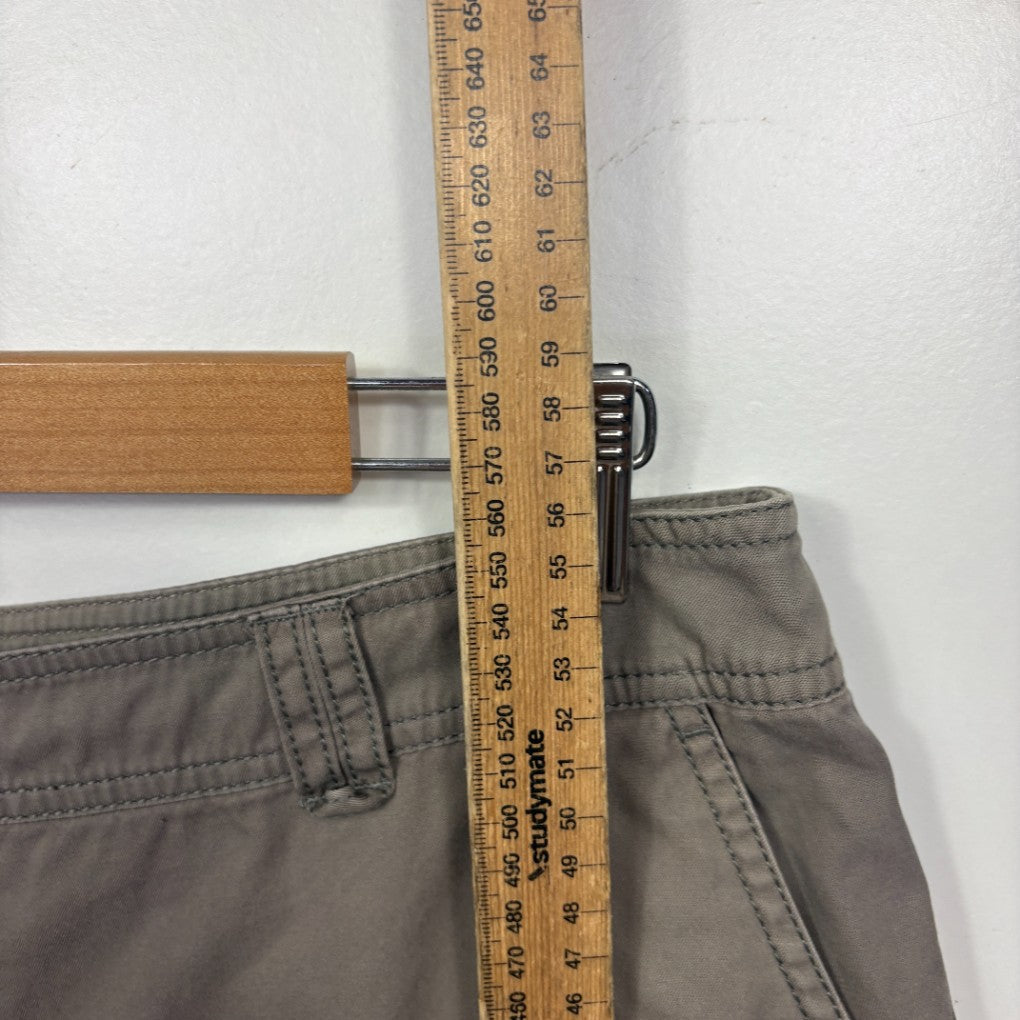 Grey shorts waistband detail view with measuring tape