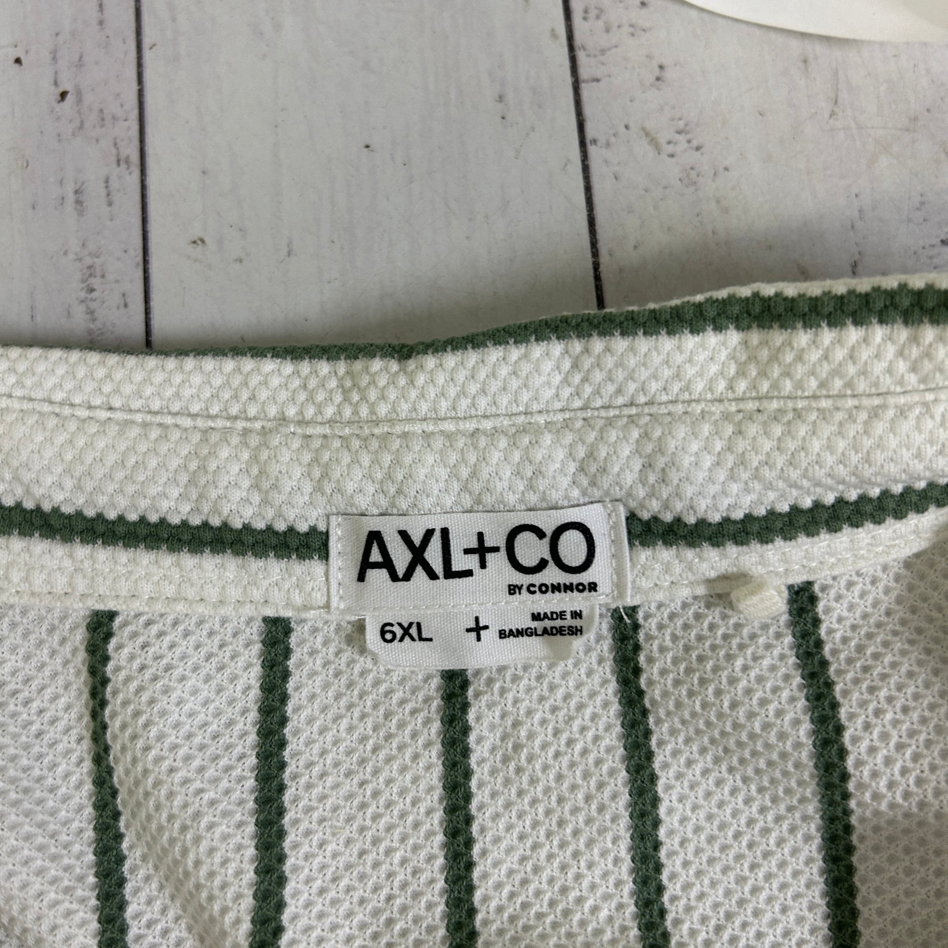 White and green striped knit top label view