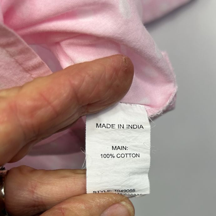 Pink cotton clothing label detail view