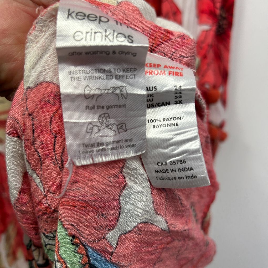 Red floral top label and care instruction detail view