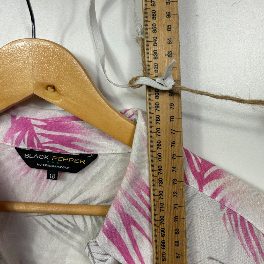 Pink and white striped top detail view on wooden hanger with measuring tape
