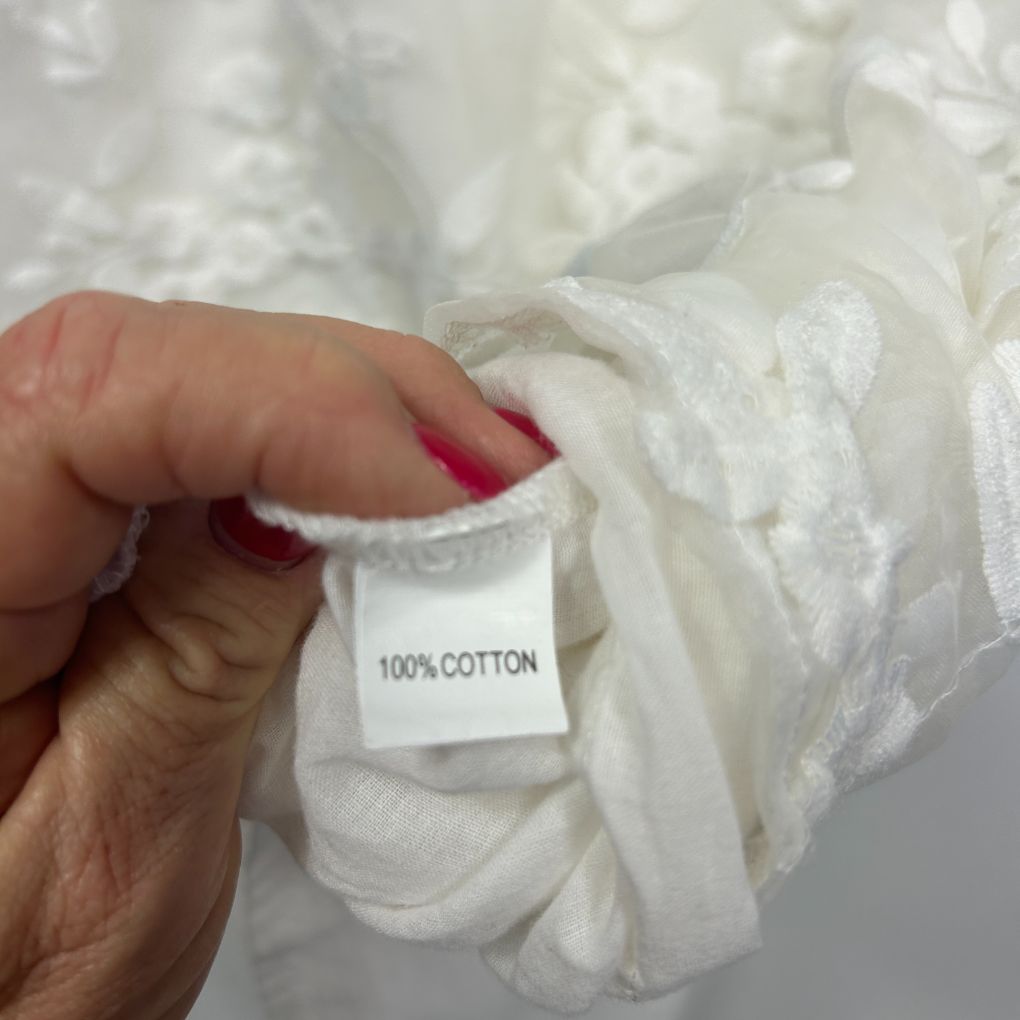 White cotton fabric label detail view