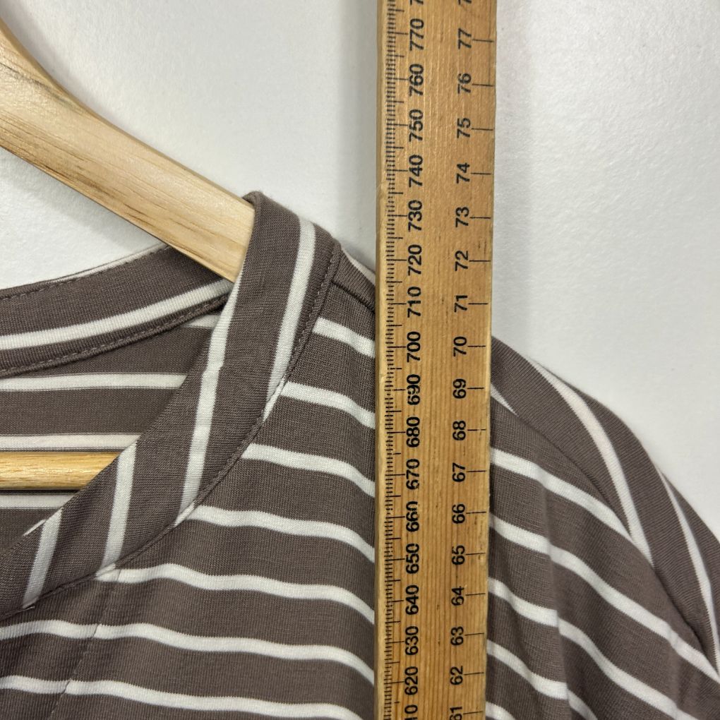 Brown and white striped top front view with wooden hanger