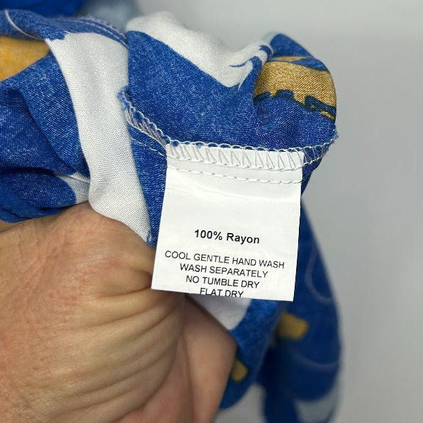 Blue yellow and white striped garment label detail view