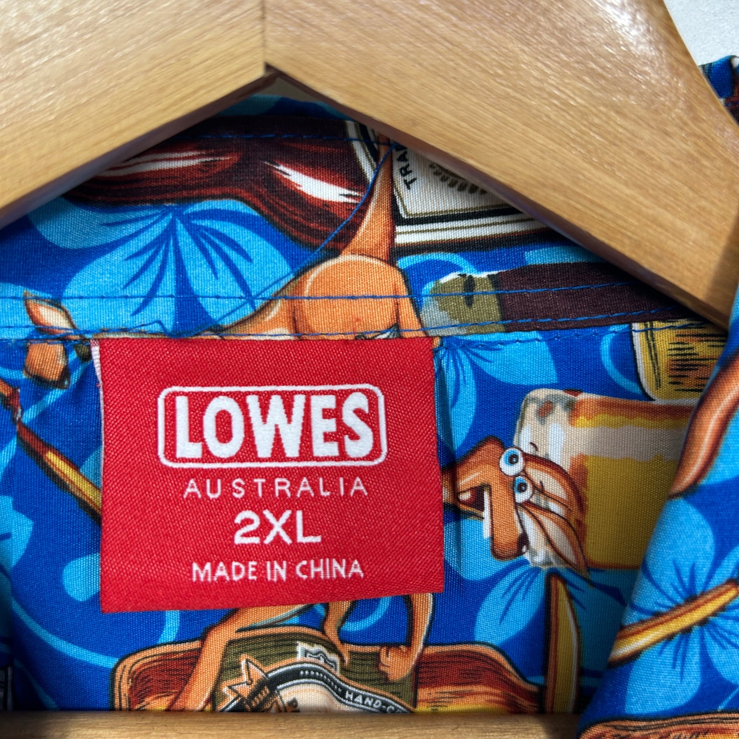 Blue shirt with brown graphic print detail view