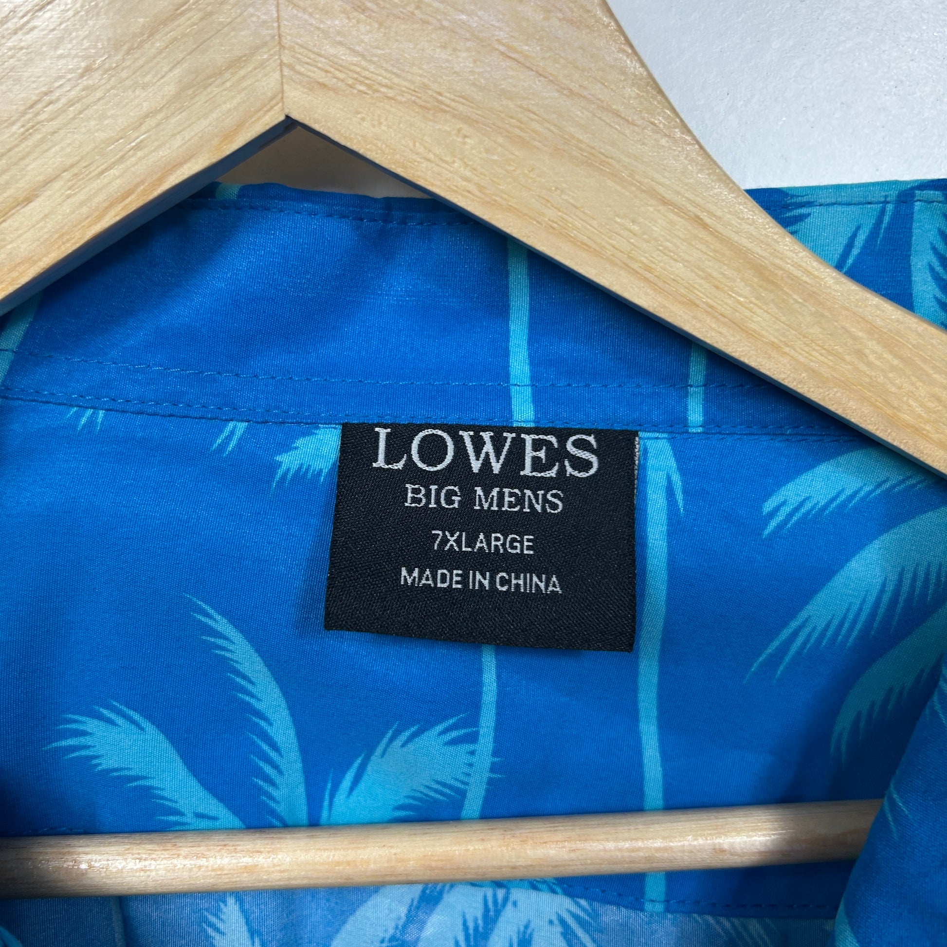 Blue shirt with feather pattern label view