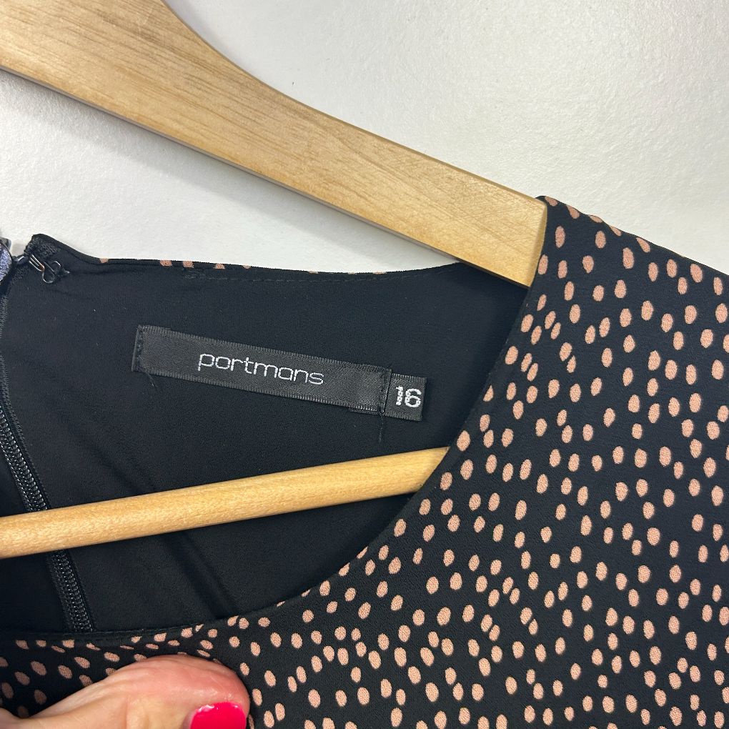 Black and tan polka dot dress detail view