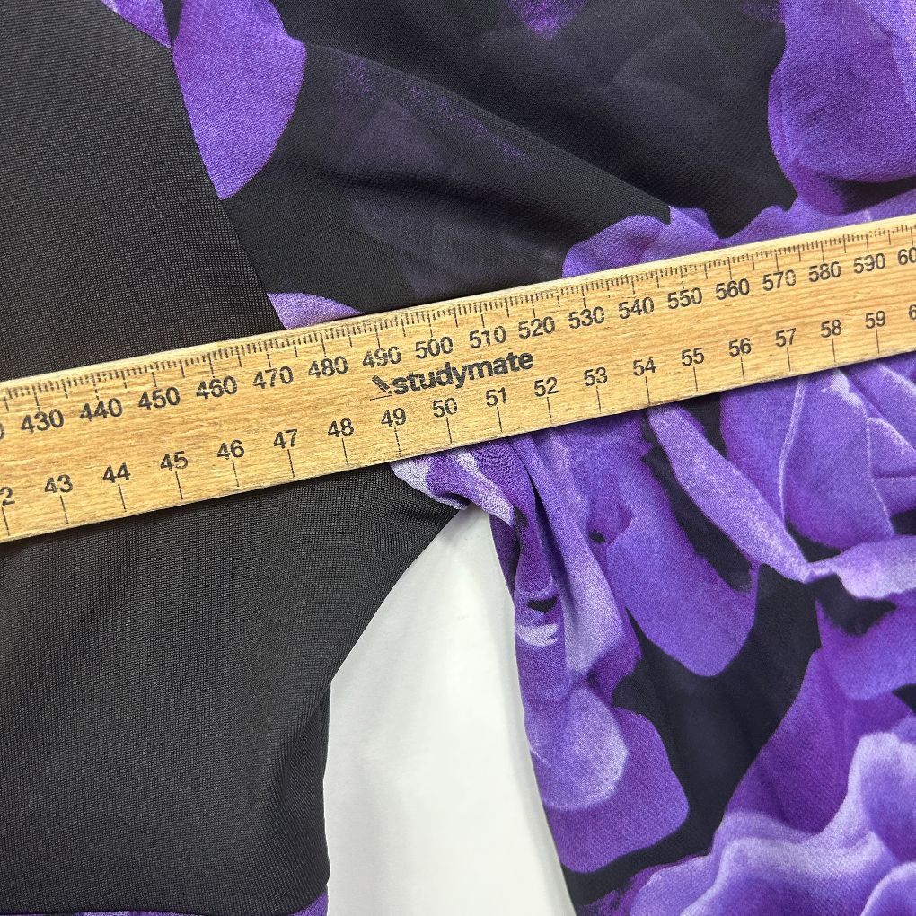Purple floral top with measuring tape detail view