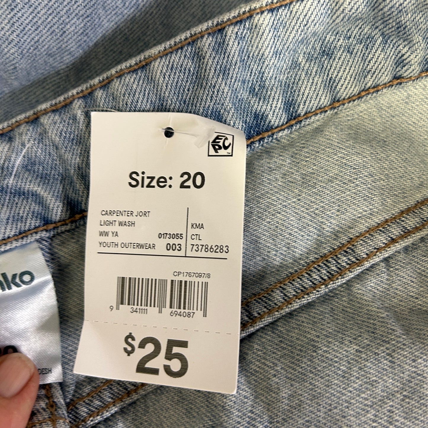 Light blue denim jeans label detail view