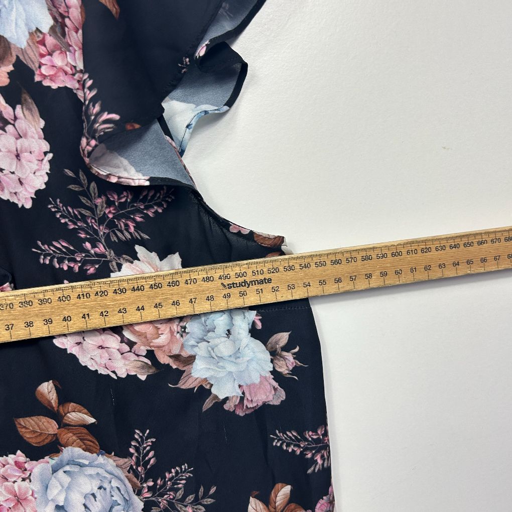 Navy floral dress with measuring tape detail view