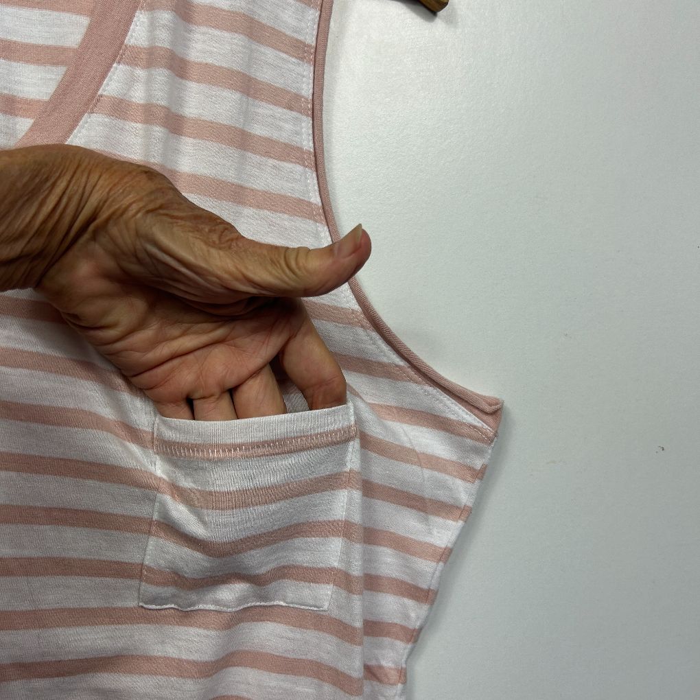 Pink and white striped tank top detail view showing pocket