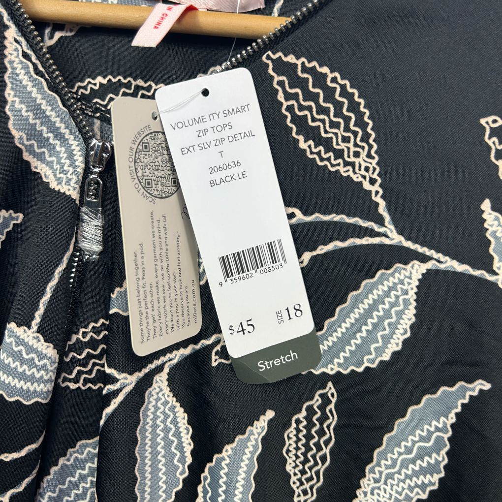 Black and white leaf print top front view with tags