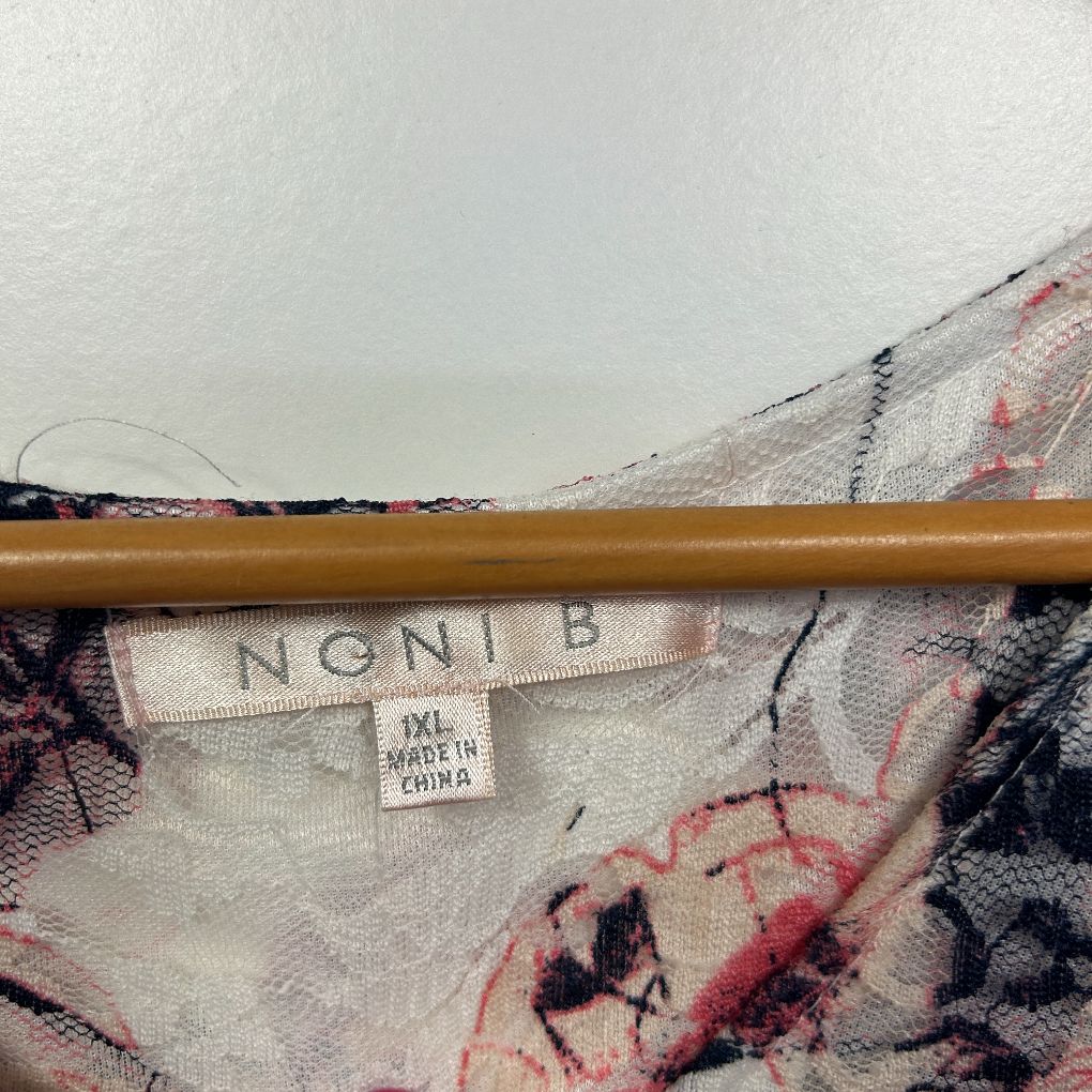Navy floral blouse label and detail view