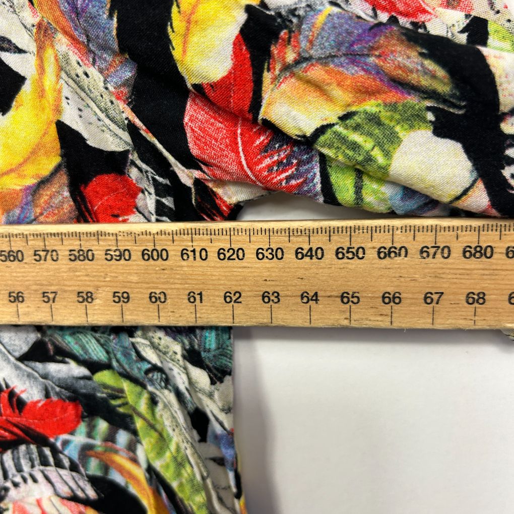 Colorful graphic print fabric detail view with ruler