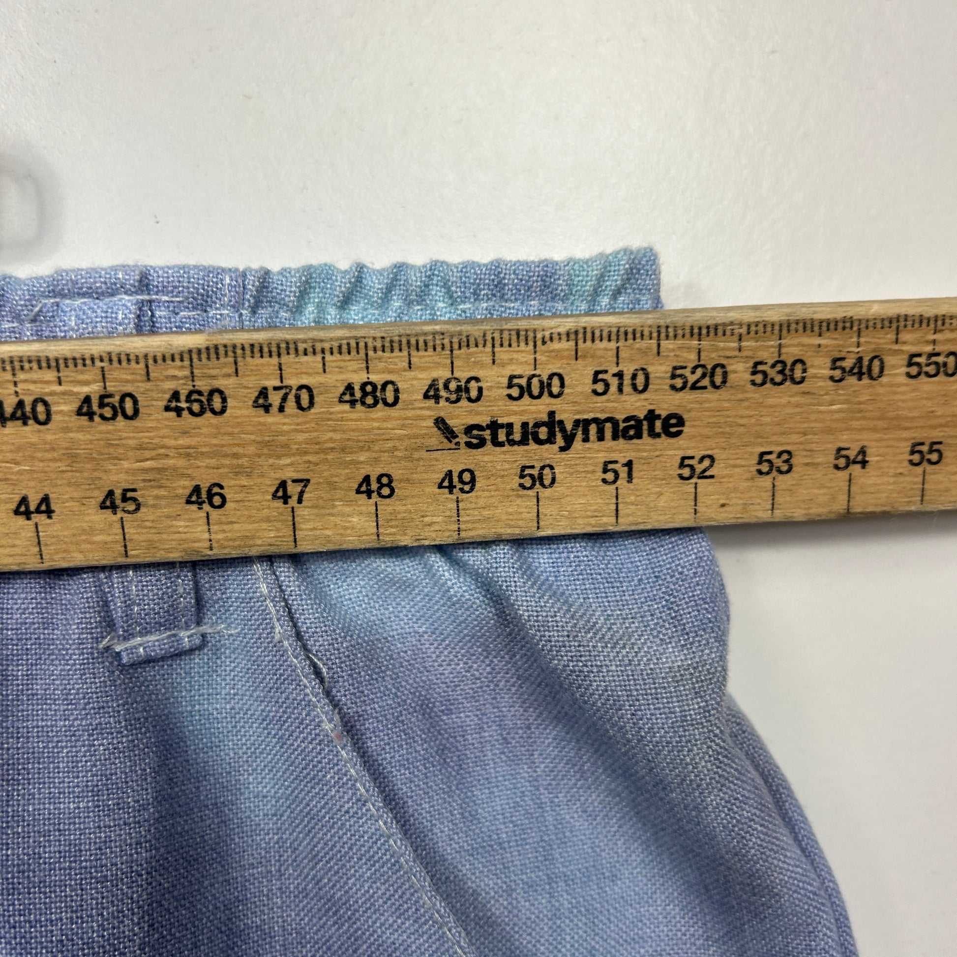 Blue fabric measured with ruler detail view