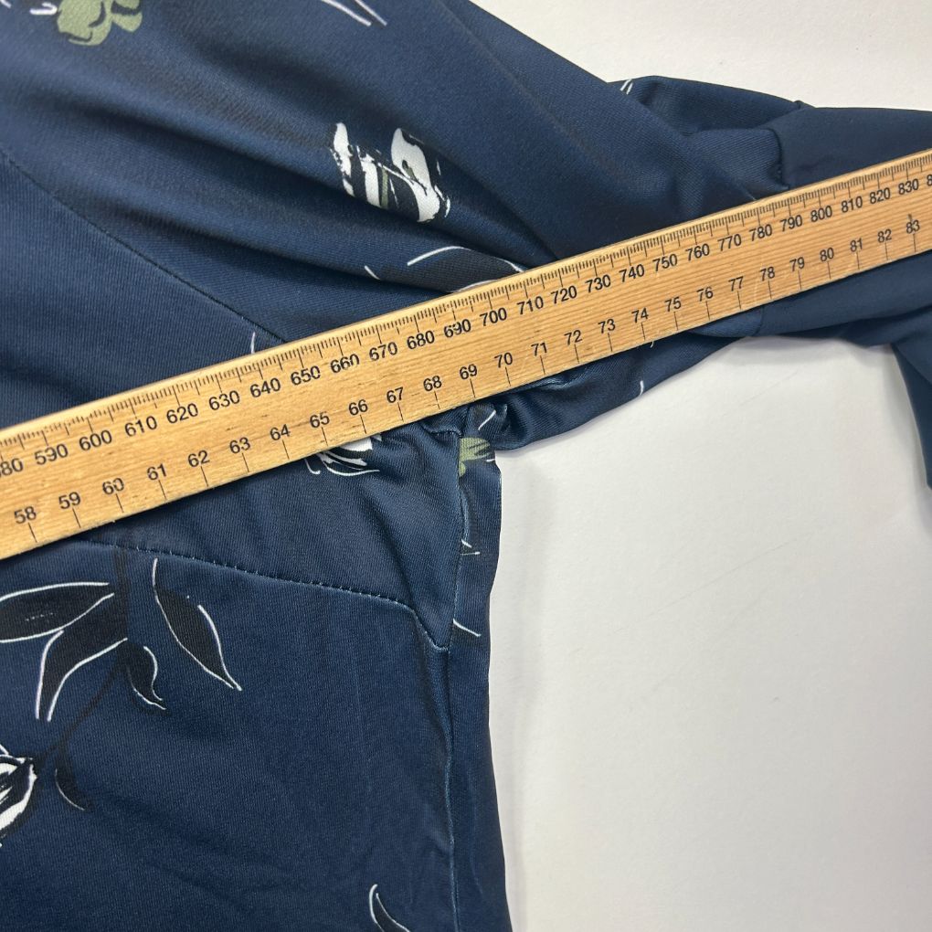 Navy blue top with graphic print detail view