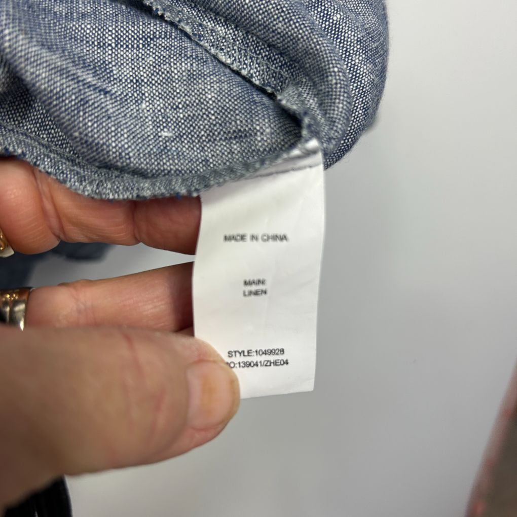 Grey linen garment label detail view