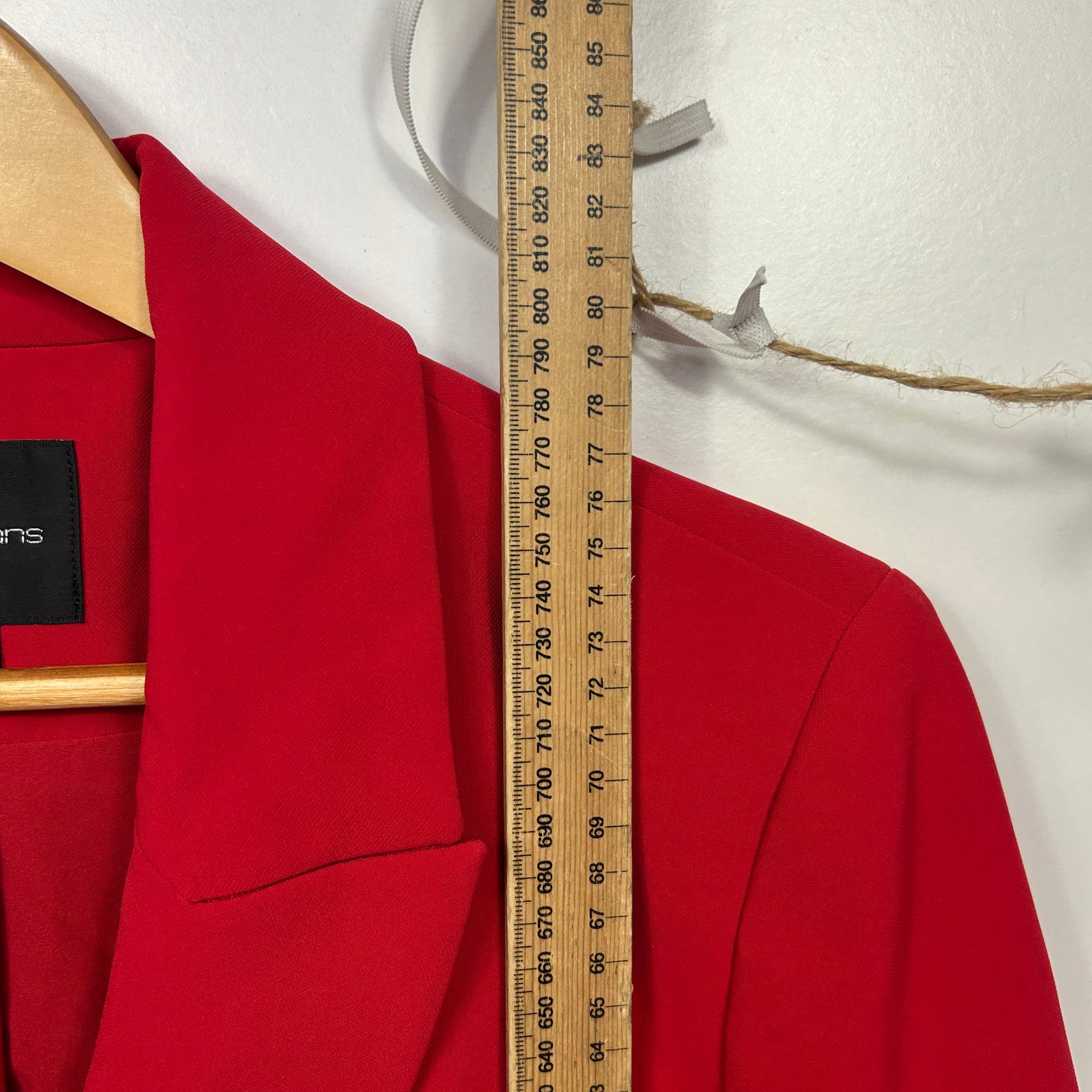 Red blazer front view with measuring tape