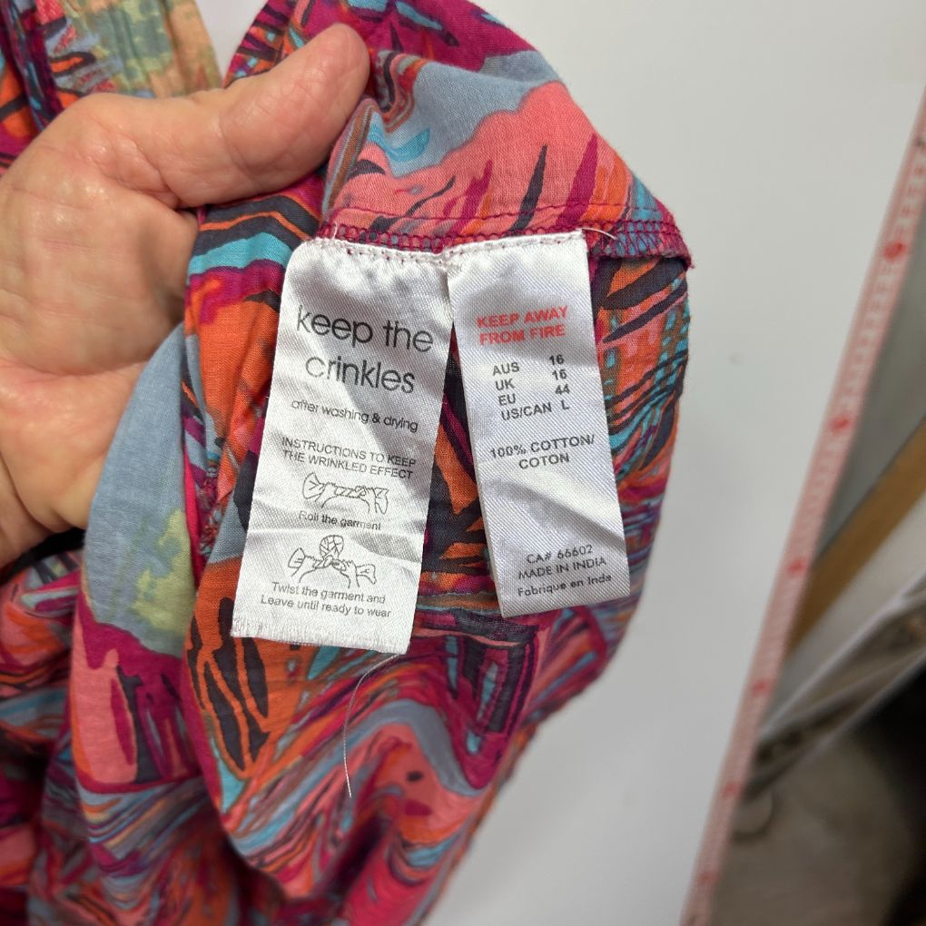 Colorful patterned shirt label detail view