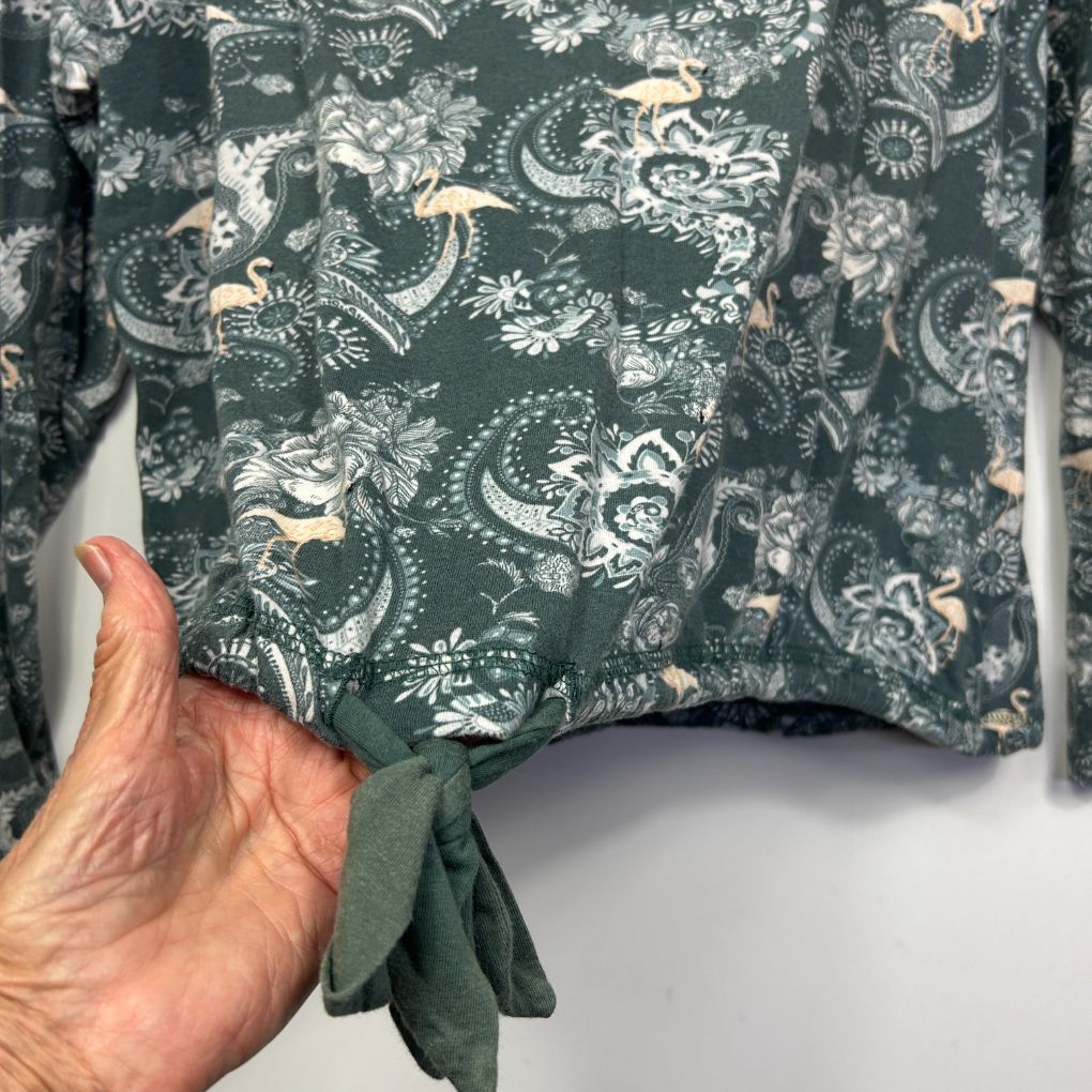 Green floral patterned shirt detail view