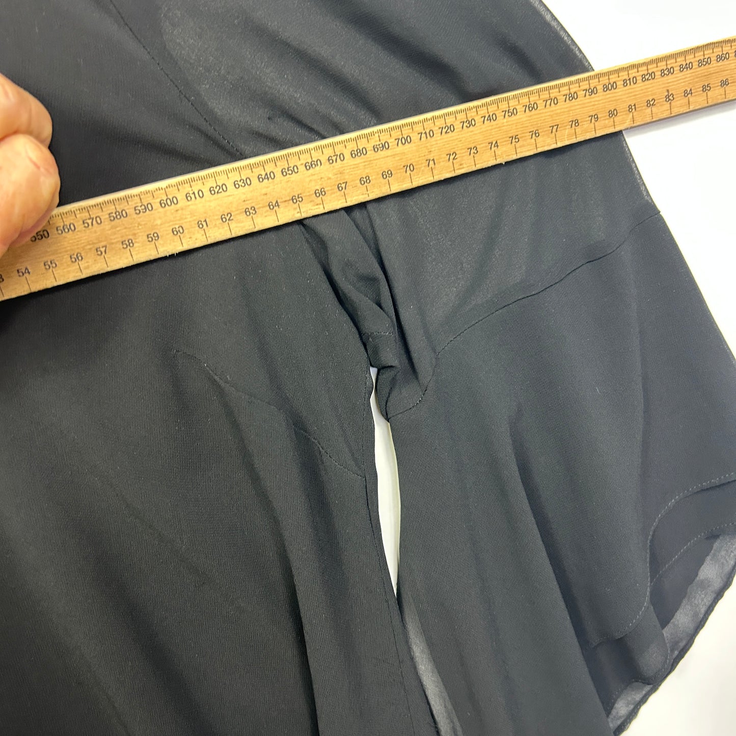 Charcoal grey pants detail view with measuring tape