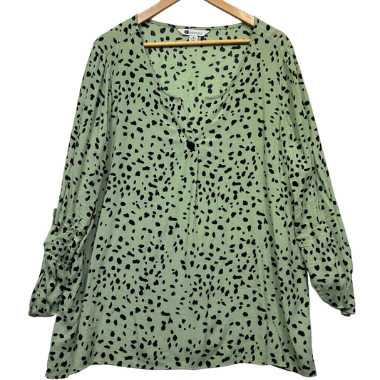 Sage green long sleeve top front view with black speckle pattern