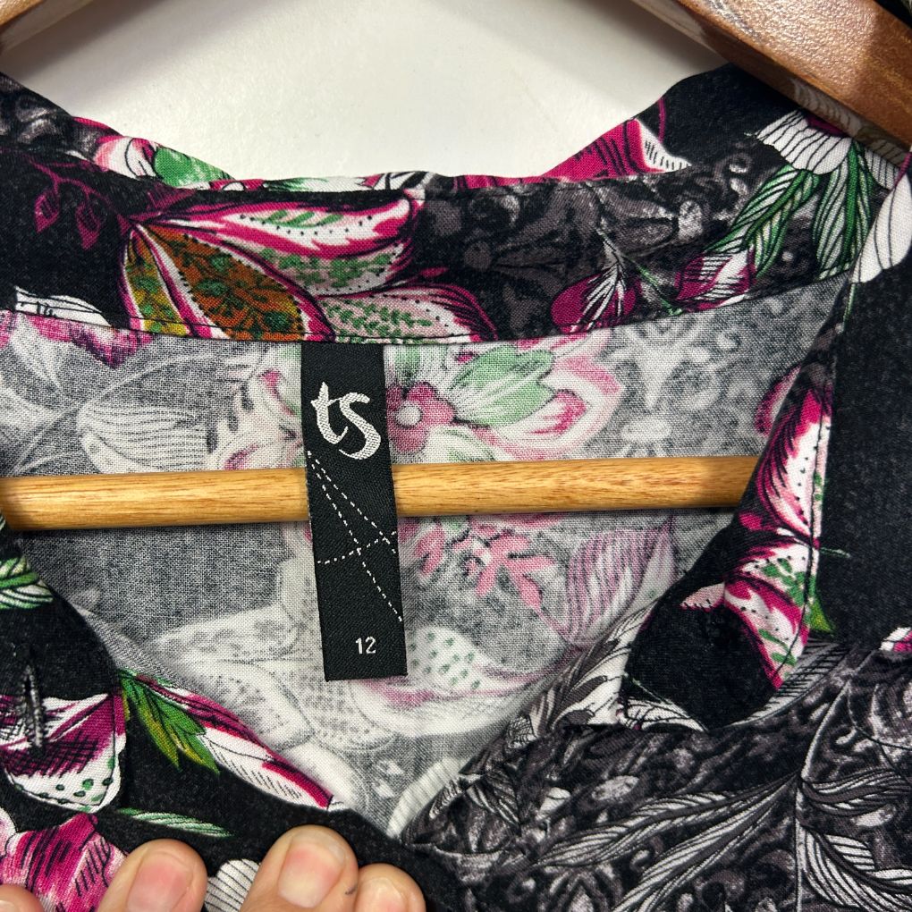 Black floral top front view with pink and green botanical print