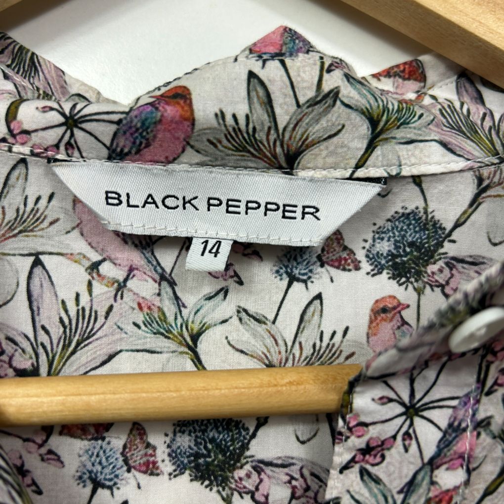 Cream floral print shirt detail view
