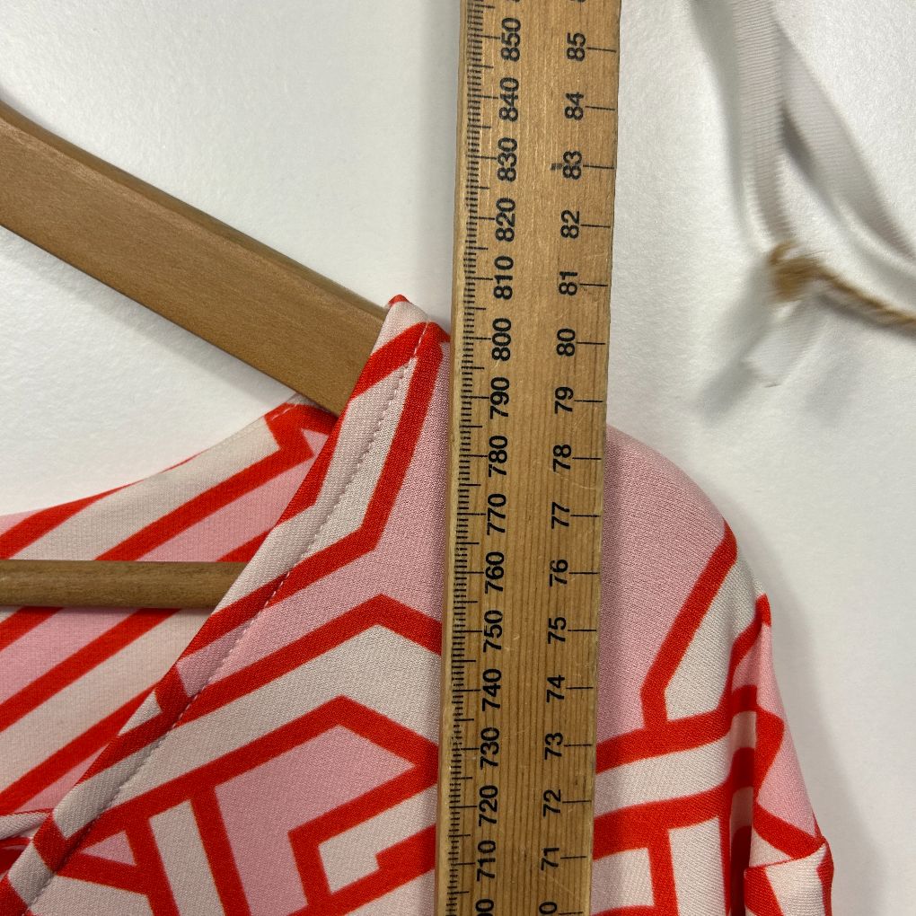 Red and white striped top front view with wooden hanger